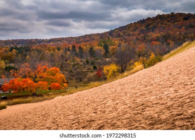 Towering Sand Dunes And Vibrant Fall Color In The Sleeping Bear Sand Dunes NAtional PArk.