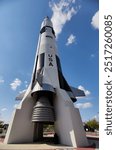 A towering Saturn V rocket displayed at the U.S. Space and Rocket Center in Huntsville, Alabama, showcasing the grandeur of America