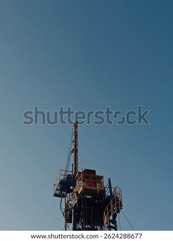 Towering strength and precision — a workover rig standing tall, ready to power energy operations