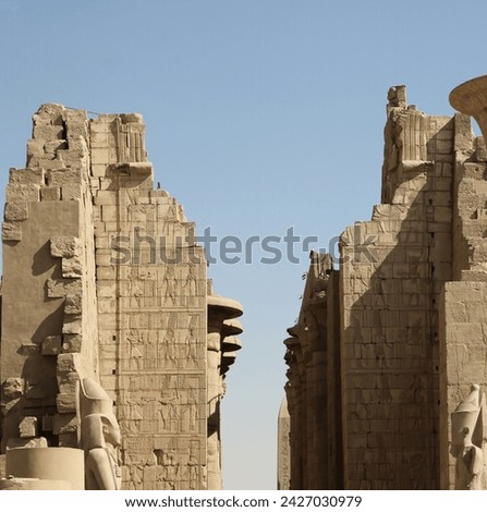 Towering walls adorned with hieroglyphs at Karnak Temple