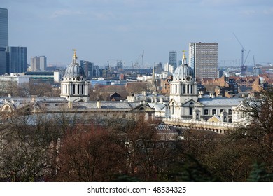 Towers Of The Old Royal Naval College, Greenwich, London, UK, A World Heritage Site, With The Construction Of The 2012 Olympic Stadium In The Background