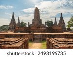 Towers (prangs) of Wat Chaiwatthanaram in Ayutthaya, Thailand. Scenic ruins of buddhist temple in the ancient city of the Ayutthaya Kingdom (Siam). Thailand is a popular tourist destination of Asia.