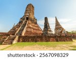 Towers (prangs) of Wat Chaiwatthanaram in Ayutthaya, Thailand. Scenic ruins of buddhist temple in the ancient city of the Ayutthaya Kingdom (Siam). Thailand is a popular tourist destination of Asia.