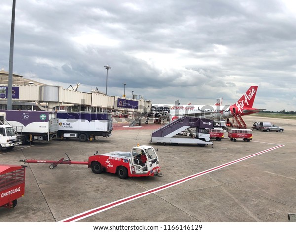 Towing Truck Pushing\
Airplane in the airport drive to push airplan, Chiang Mai, THAILAND\
- august 26, 2018  