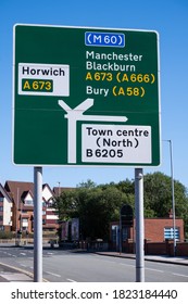 Town centre street sign for A roads and motorway in Bolton Lancashire July 2020