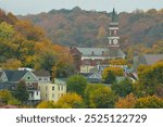 Town Clock Church and surrounding neighborhood in Cumberland Maryland on an autumn day surrounded by colorful fall foliage