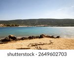 Town of Cres panorama, photographed from the other side of the blue bay of Cres island, Croatia