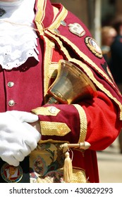 Town Crier In The City Of Oxford Holding His Bell While Making An Announcement