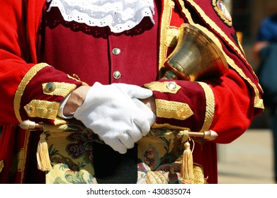 Town Crier In The City Of Oxford Holding His Bell While Making An Announcement