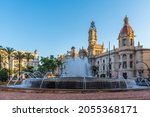 Town hall behind a fountain in Spanish town Valencia