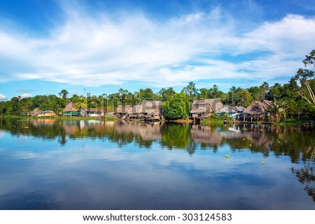 Town on the shore of the Yanayacu River in the Amazon rain forest near Iquitos, Peru