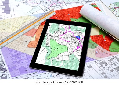 Town Planning And Land Use - Digital Tablet Displaying A Land Use Plan, Placed On French Maps Of Local Town Planning 