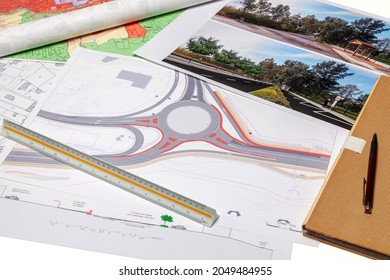 Town Planning And Land Use Planning - Floor Plan Maps Of A Road And Roundabout Project, Placed On A Desk 