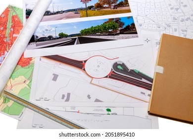 Town planning and land use planning - Floor plan maps of a road and roundabout project, placed on a desk 