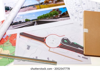 Town Planning And Land Use Planning - Floor Plan Maps Of A Road And Roundabout Project, Placed On A Desk 