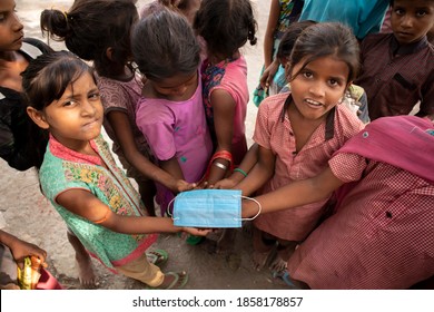 Town Puranpur, Village Bhaipur / India On 9th October 2020 Village Kids Were Playing With A Face Mask. During The Pandemic Of Corona Virus We Are Unable To Provide Masks In Rural Areas Of India.

