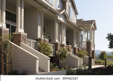 Townhome Porches Along A Common Walkway.