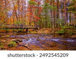 Townsend, Tennessee, USA - Nov. 2, 2017: Fall foliage adds splashes of color at the trailhead to Abrams Falls in Cades Cove at Great Smoky Mountains National Park in Tennessee. 