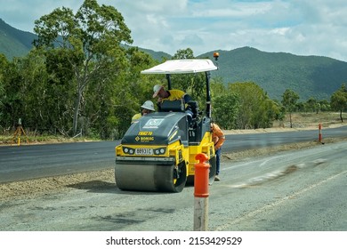 Townsville, Queensland, Australia - May 2022: Works Inspect A Roller During Road Works On The Highway.