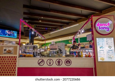 Townsville, Queensland, Australia - November 2021: Staff Serving Customers At Donut King Store In Shopping Center