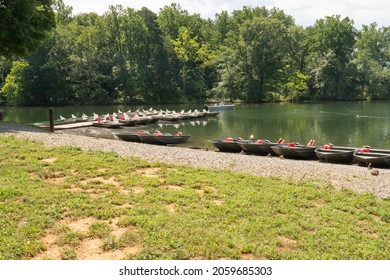 Towson, Maryland, US - June 30, 2021: Beyond The Grass Is A Floating Dock For Upgraded Bass Boats And Aluminum Flat Bottom Jon Boats For Rent At Loch Raven Fishing Center