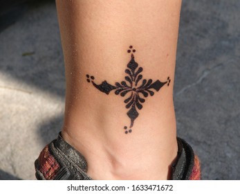 Toxic Black Henna Tattoo On A Woman's Ankle