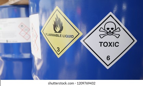 Toxic and flammable label on barrels in outdoor storage yard