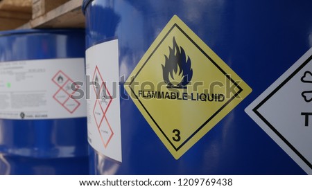 Toxic and flammable label on barrels in outdoor storage yard