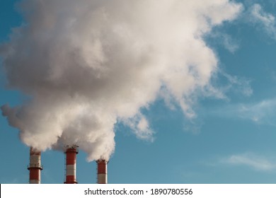Toxic smoke from a factory chimney in the sky - industrial waste in the atmosphere