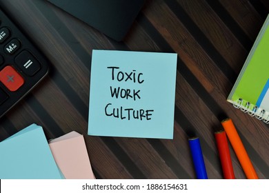 Toxic Work Culture Write On Sticky Notes Isolated On Wooden Table.