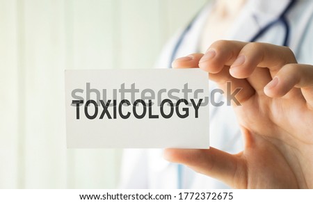 Toxicology on the Document with yellow background. Healthcare or Medical concept