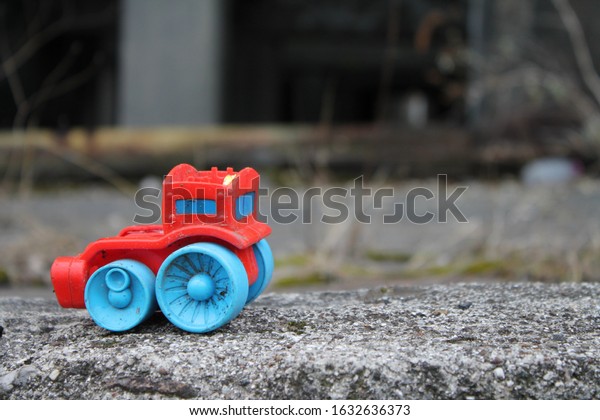 Toy abandoned in a disused\
factory
