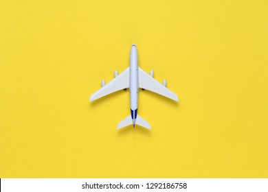 Toy Airplane On Yellow Table Top View