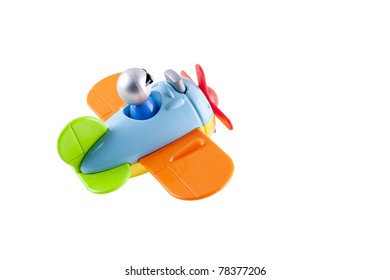 Toy Airplane With A Pilot On A White Background