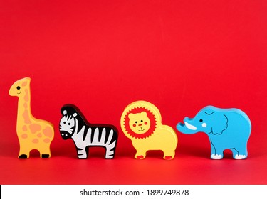 Toy Animals Isolated Against A Red Background