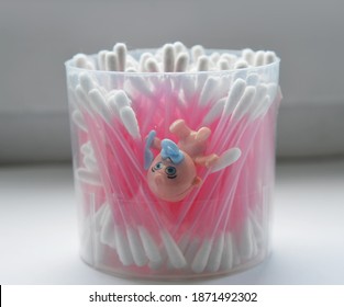 toy baby drowning in a box with cotton buds 