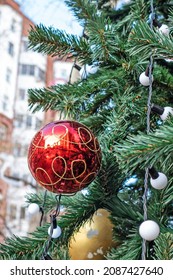 A Toy Ball On A Christmas Tree In A Thief Of A Multi-storey Apartment Building