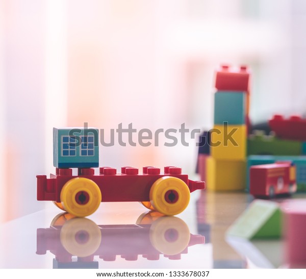 Toy block\
with building and car for city\
concept