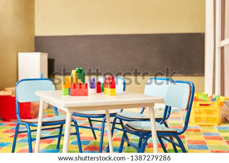 Toy blocks as a toy on a table in an empty room in the nursery