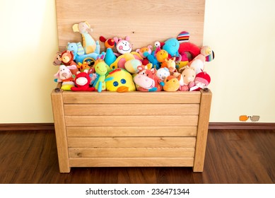 Toy Box Full Of Soft Toys In A Child's Bedroom