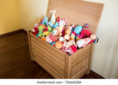 Toy Box Full Of Soft Toys In A Child's Bedroom