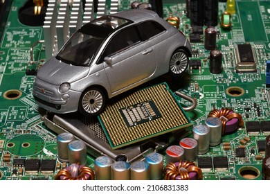Toy car with CPU. The shortage of microchips and semiconductors creates a shortage of new cars. Conceptual image for semiconductor shortage disrupting production of the automotive industry.
