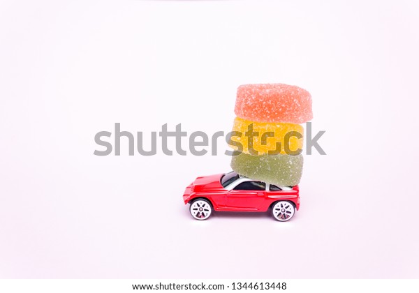 Toy car,\
delivery of sweets, car with\
marmalade