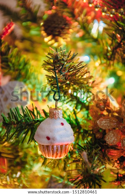 Toy car with gifts, horse, angel, cupcake, Santa\'s\
clothes for the holiday tree, Christmas toy, life style, garland\
with lights