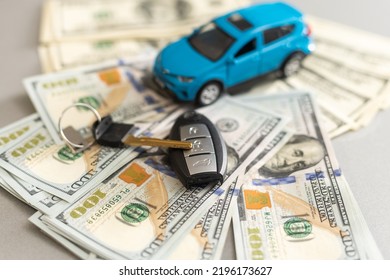 Toy Car, Keys And Money On Table