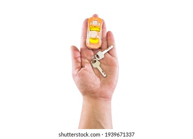 Toy Car And Keys On The Palm Isolated On White Background. View From Above. Copy Space.