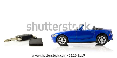 Toy car with a keys on white background with mirror