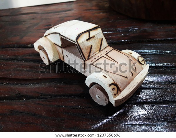 toy car made of\
wood