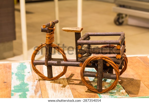 a toy car made of wood to bring to the show or a\
bucket of