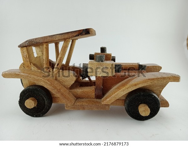 a toy car made of\
wood is very unique